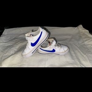White NIKE with Blue SWOOSH, gently used